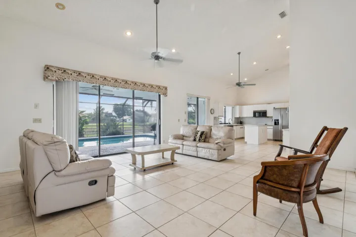 Large, bright and airy living overlooking the pool and lake