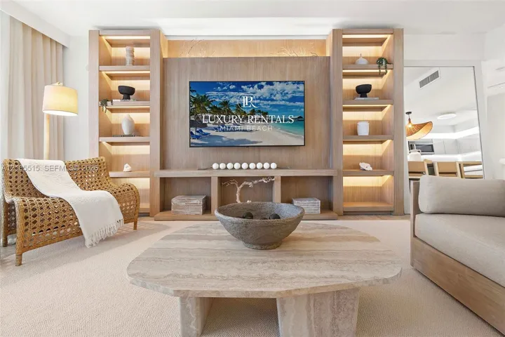 Custom floor-to-ceiling wood shelving unit with integrated LED accent lighting