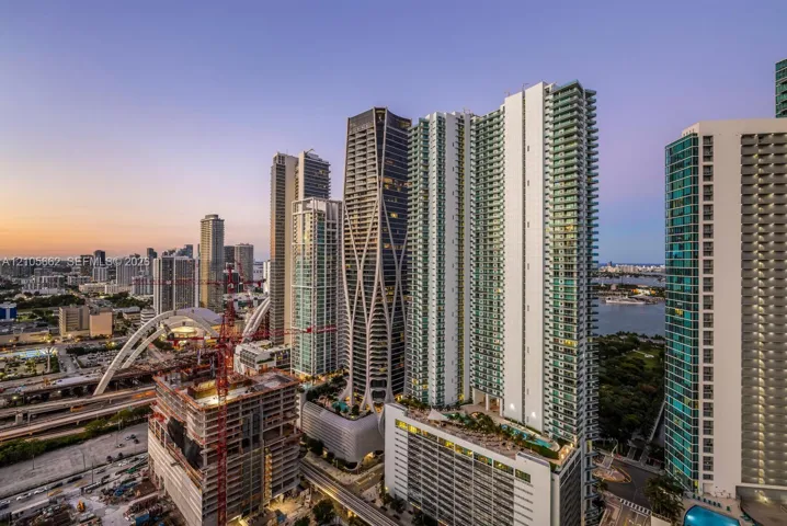 High-rise urban towers featuring glass facades, balconies, and multi-level structural designs