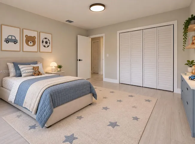 Neutral-toned interior featuring wood-finish flooring, white louvered-panel closet doors, and flush-mount circular lighting
