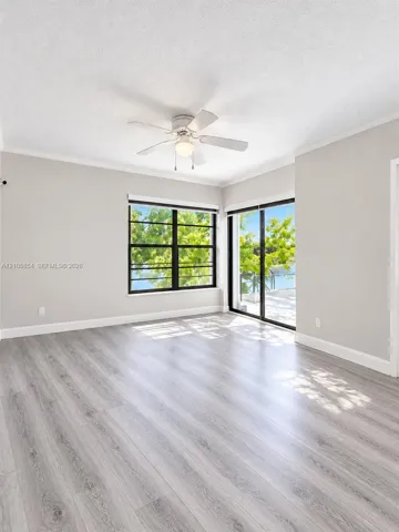 Edited image showing how the room would look without furniture, highlighting its spacious layout, beautiful flooring and stunning lake view.