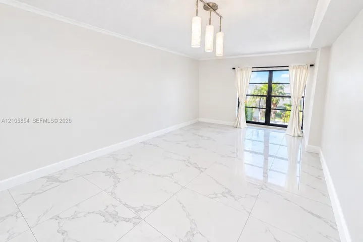 Edited image showing how the room would look without furniture, highlighting its spacious layout, beautiful flooring and stunning lake view.