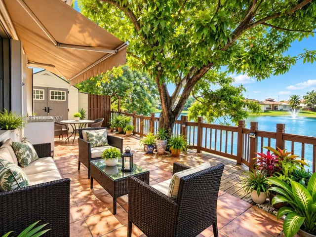Paved patio and lakefront deck, perfect for outdoor dining, entertaining, or relaxing while enjoying peaceful water views.