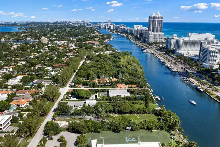 Waterfront property featuring deep-water access, a private dock, and an expansive lawn