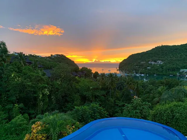 Beautiful golden sunset with sweeping views of lush green hills.