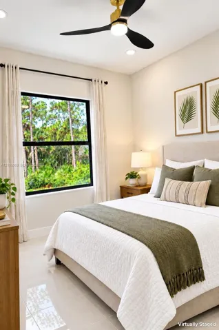Light-filled room featuring large-format polished tile flooring, black-frame window, and a three-blade modern ceiling fan with a central light fixture