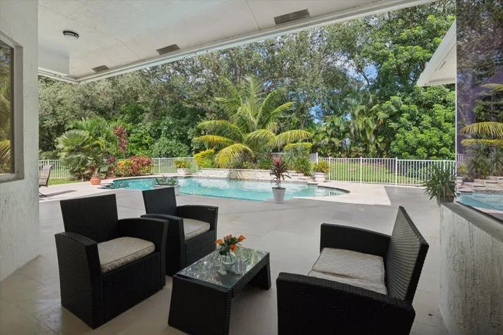 Back patio with mature landscaping
