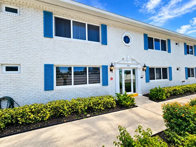 Mid-Century Condo Entrance with Blue Shu