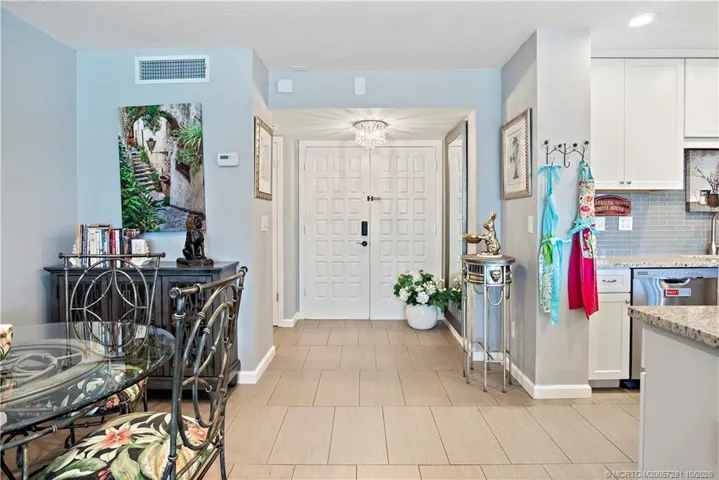 View from the Living Room - The 24"x12" Woodgrain Tile is throughout the Condo, including Bedrooms and Baths.
