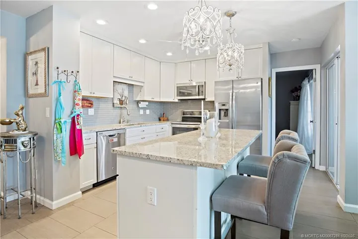 SO very, very Bright with Chandelier and Recessed Lighting. ALL Furniture, Furnishings and Decorative Items are included in the Sale.