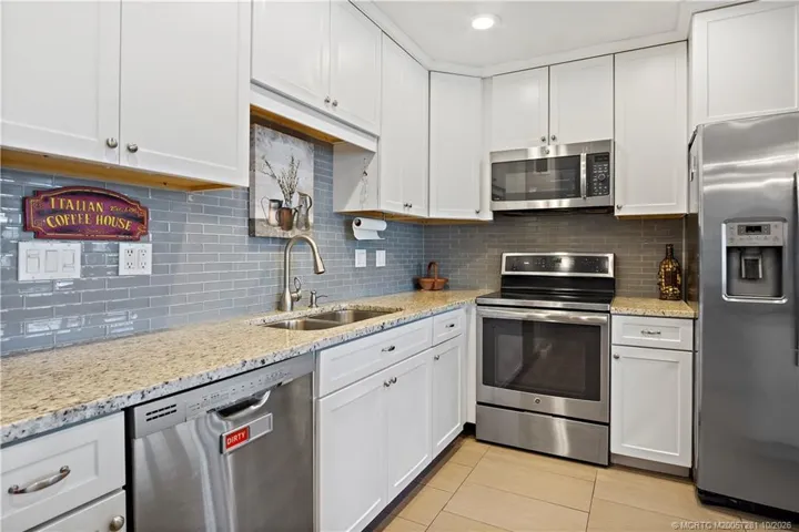 Renovated Kitchen with light Granite Counters, Large Island, 39" Cabinetry, Deep 23" Island Cabinets PLUS 2 (two) 15" Deep Drawers, GE Profile Appliances