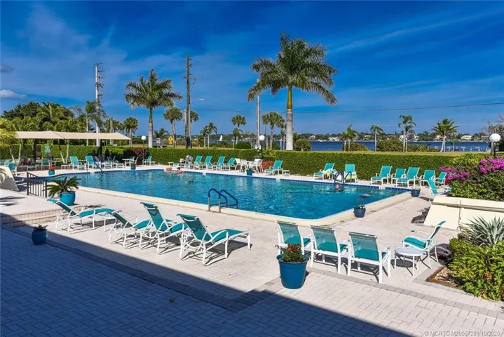 Sparkling Clubhouse Complex Pool with view of the Saint Lucie River