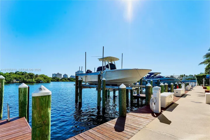Boat Slip with Lift available for Additional Purchase. 12' Beam accommodating approximately 38' Center Console. Water & Electricity are Provided.