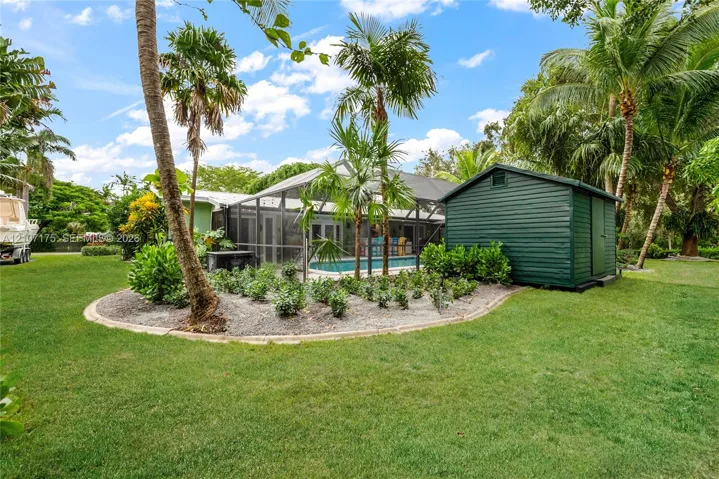 Lush yard and storage one of 2 sheds.