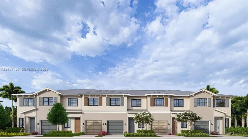 Multi-family exterior featuring a neutral stucco facade, decorative shutters, gabled rooflines, and individual garage bays