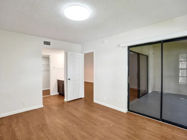 screened balcony access from primary bedroom and living room