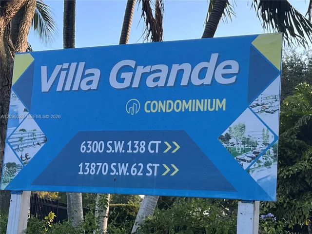 Villa Grande condominium signage featuring two-way directional markers and embedded imagery of communal grounds