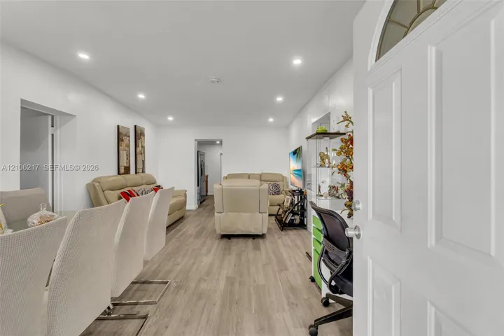 Entryway featuring wood-finish flooring and recessed lighting