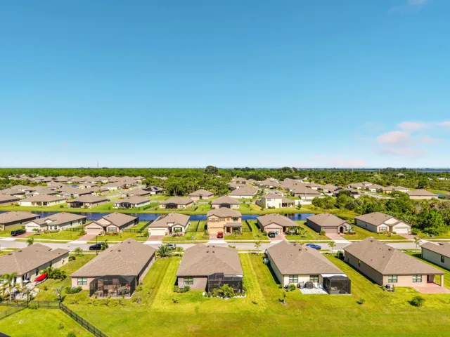 Back shot of home aerial with other home