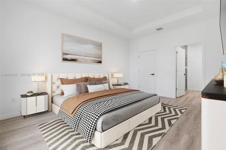 Tray ceiling, wood-finish flooring, and six-panel interior doors