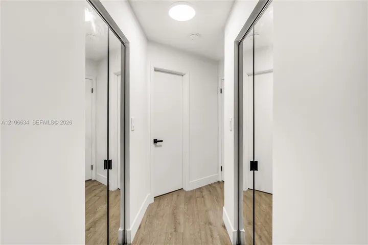 Two walk-in closets at entry way of Primary Bedroom