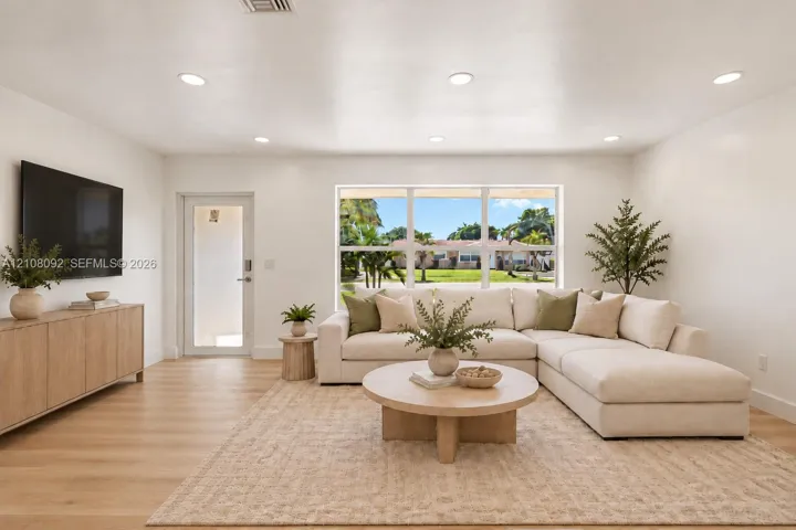 Interior space featuring recessed lighting, wood-finish flooring, and a large picture window