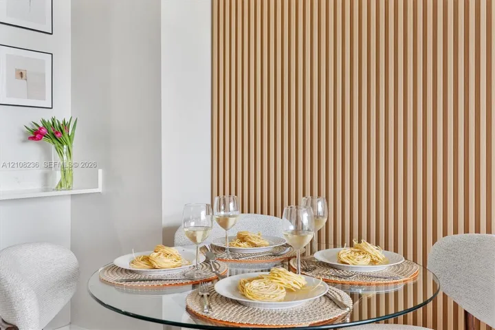 Vertical wood-slat accent wall with a matte finish and a built-in floating​​‌​​​​‌​​‌‌​‌‌​​​‌‌​‌​‌​‌​​​‌​​ shelf