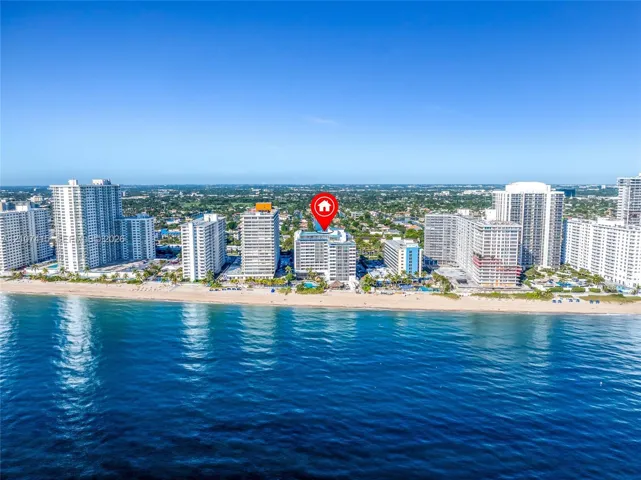 High-rise residential building situated on the Atlantic coastline featuring direct beach access and an outdoor swimming pool