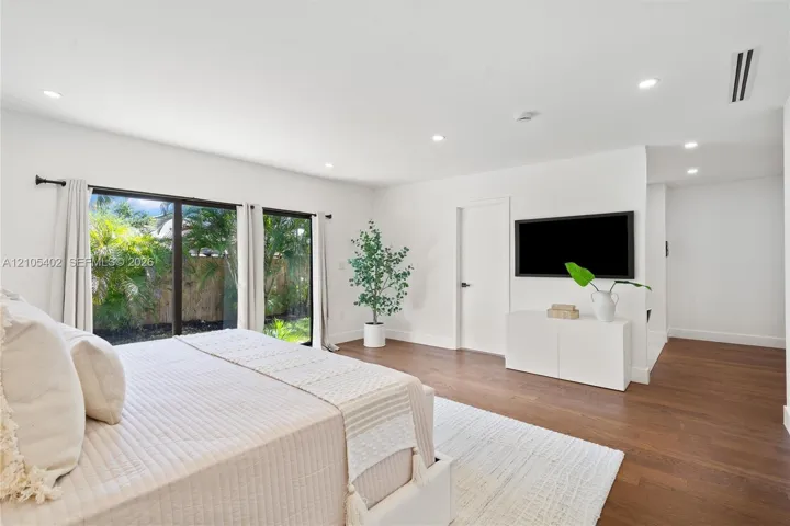 Interior space featuring wood-finish flooring, recessed lighting, and large sliding glass doors