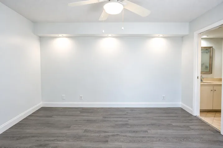 Sliding doors lead out to patio overlooking courtyard. Walk in closet