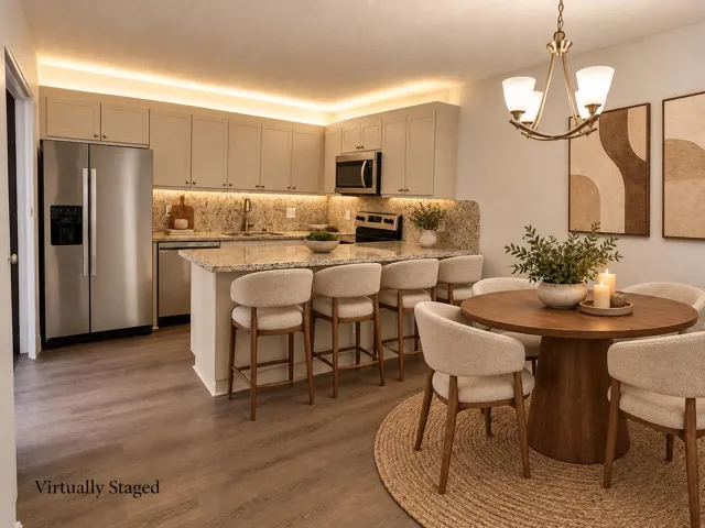 Virtually staged kitchen with upgraded laminate flooring and granite counter tops