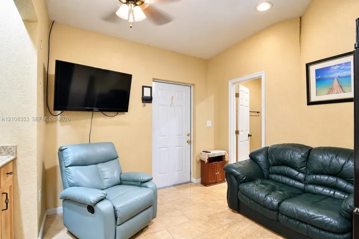 In-Law Living Room with fan with integrated lighting