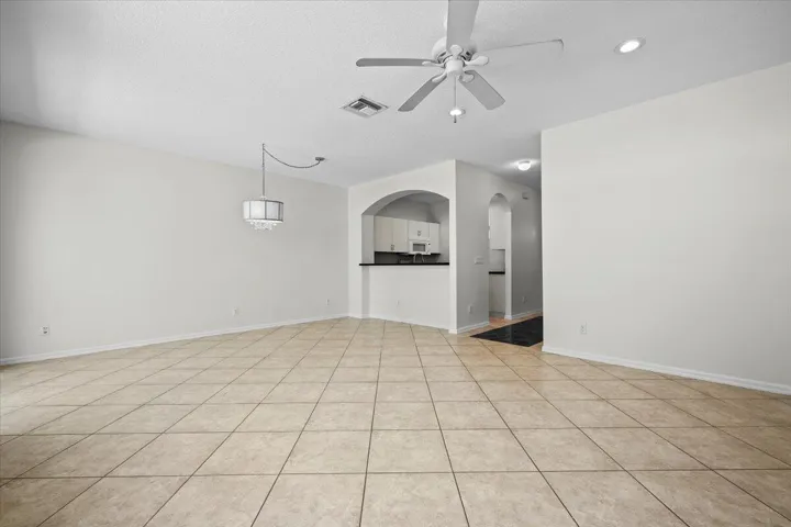 Spacious dining area with an open layout, neutral finishes, and plenty of natural light.