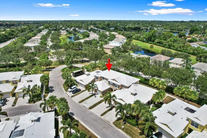 Aerial view highlighting the home's newer roof and surrounding residential community.