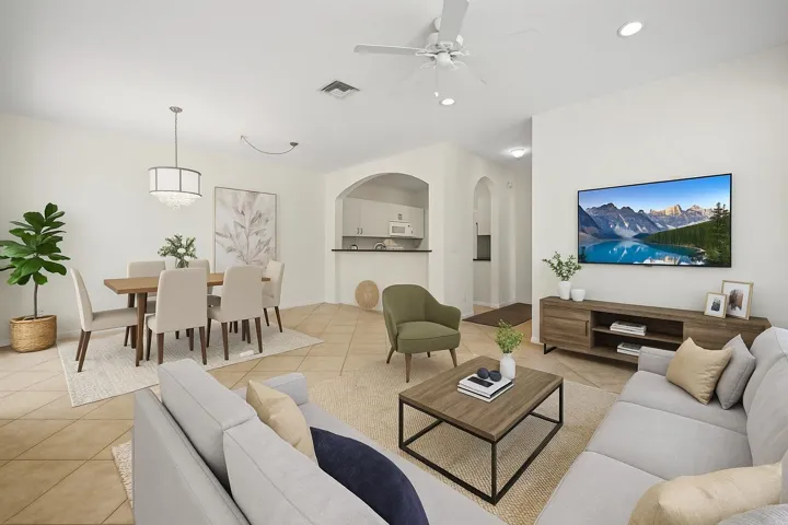 Virtually staged to showcase the spacious living and dining area with an open layout and natural light.