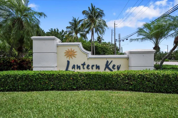 Welcoming entrance to the Lantern Key community featuring attractive tropical landscaping.