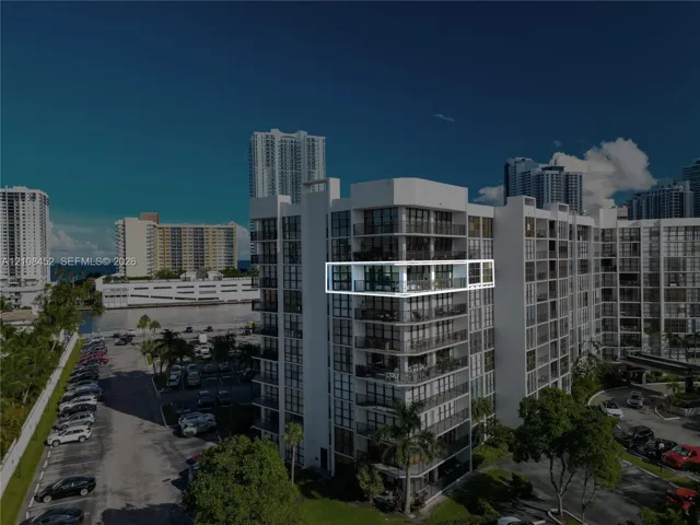 High-rise unit featuring a private balcony, floor-to-ceiling glass windows, and aluminum railing