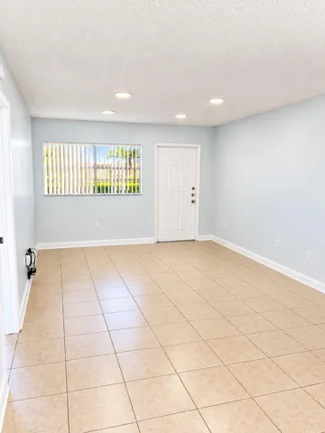 Bright Minimalist Room with Window and D