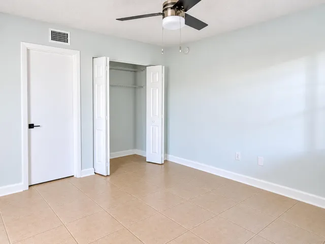 Bright Empty Bedroom with Open Closet