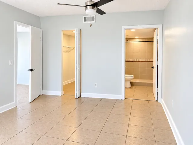 Bright Neutral Room with Open Doorways