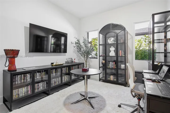 Neutral-toned interior featuring dual windows and light-toned flooring