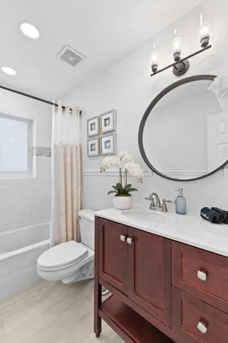 Bright Coastal Bathroom with White Orchi