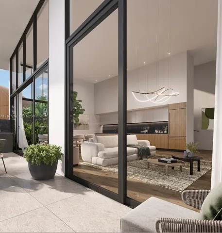 Floor-to-ceiling glass wall panels with black framing, wood-finish flooring, custom wood-veneer cabinetry, recessed ceiling lighting, and sculptural LED pendant lighting