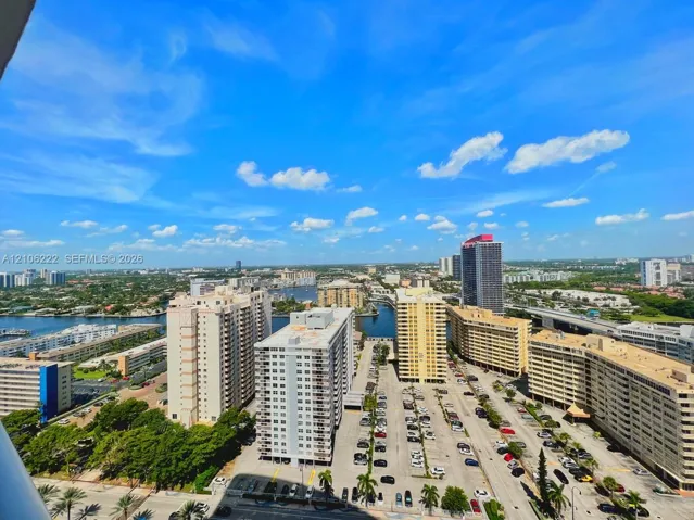 High-rise perspective featuring expansive urban scenery and water elements