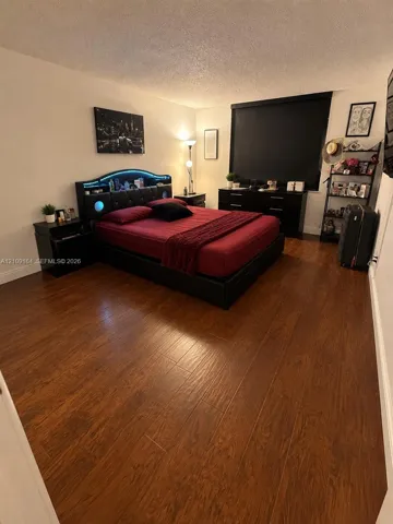 Wood-finish flooring throughout and a blackout window shade