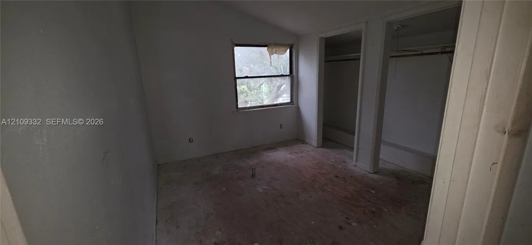 Vaulted ceiling, natural lighting, and dual reach-in closet spaces
