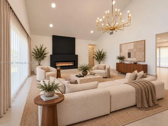 Vaulted ceiling, floor-to-ceiling windows, matte black linear fireplace, and tiered metal chandelier