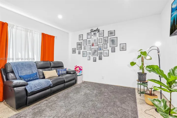 Neutral-toned interior space featuring recessed lighting and wall-to-wall carpeting