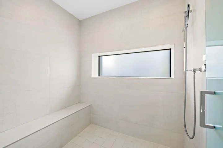 Primary bath shower bench + shampoo niche