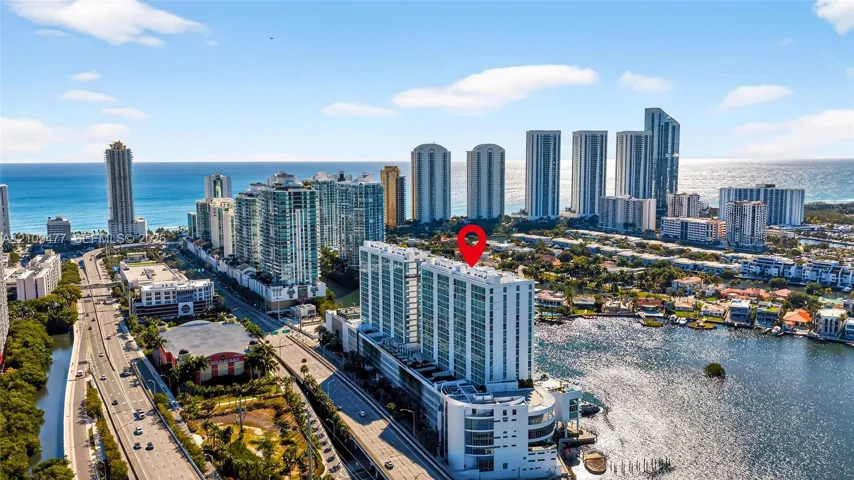 High-rise residential building featuring expansive water frontage, proximity to the coastline, and a prime urban setting